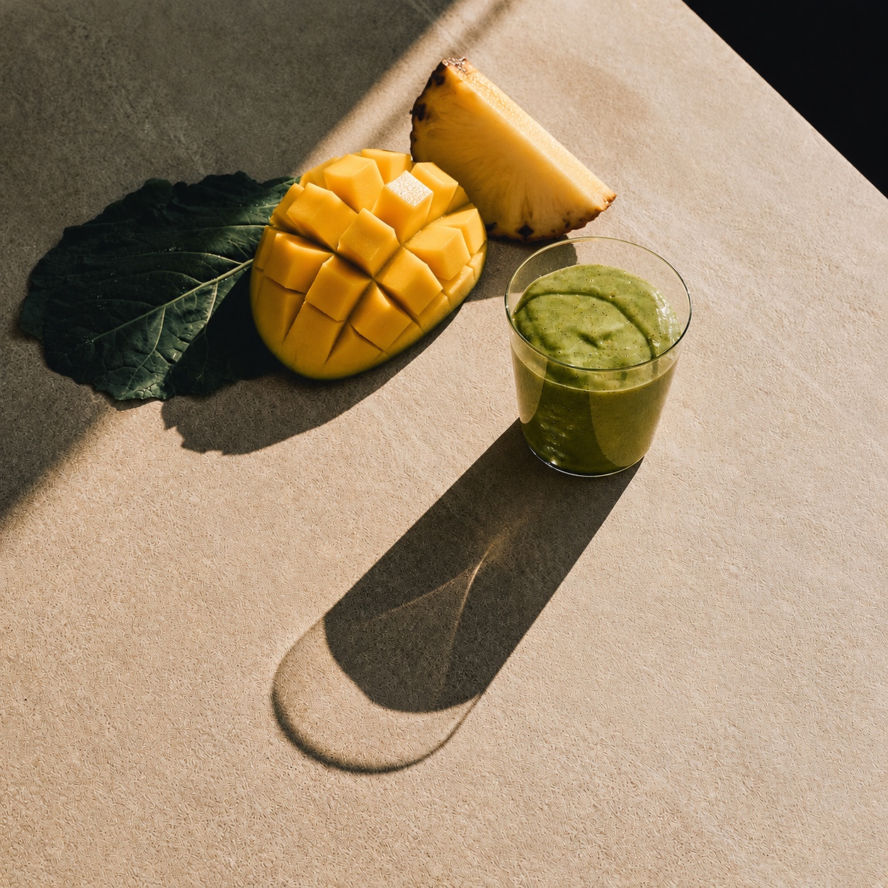 Green wellness drink with mango and pineapple